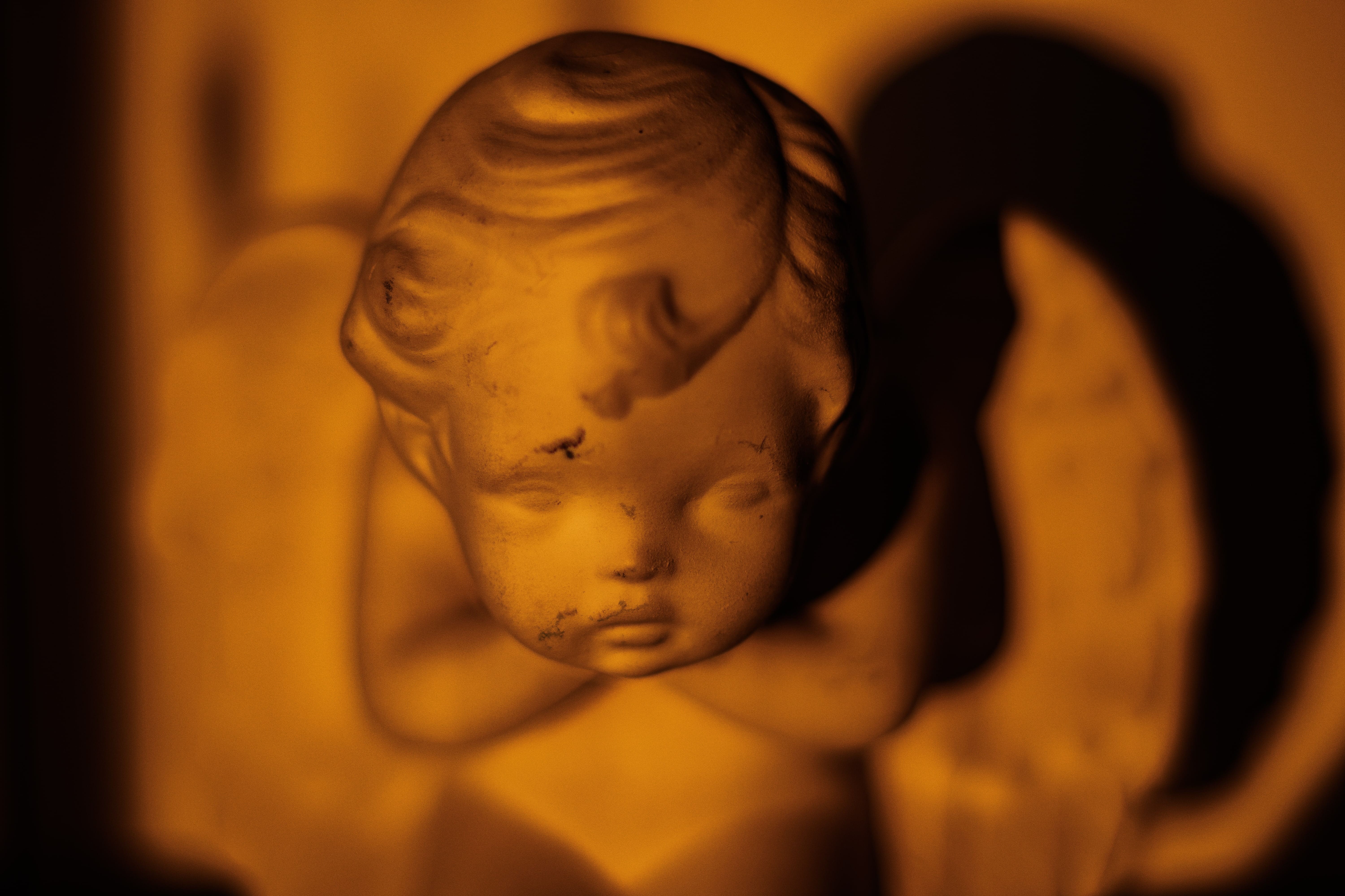 A photo of a golden cherub statue.